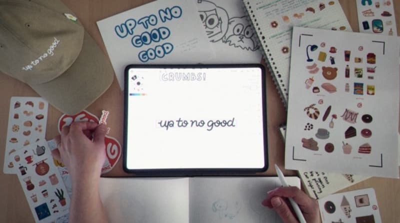 Hands drawing overhead — Up To No Good scene